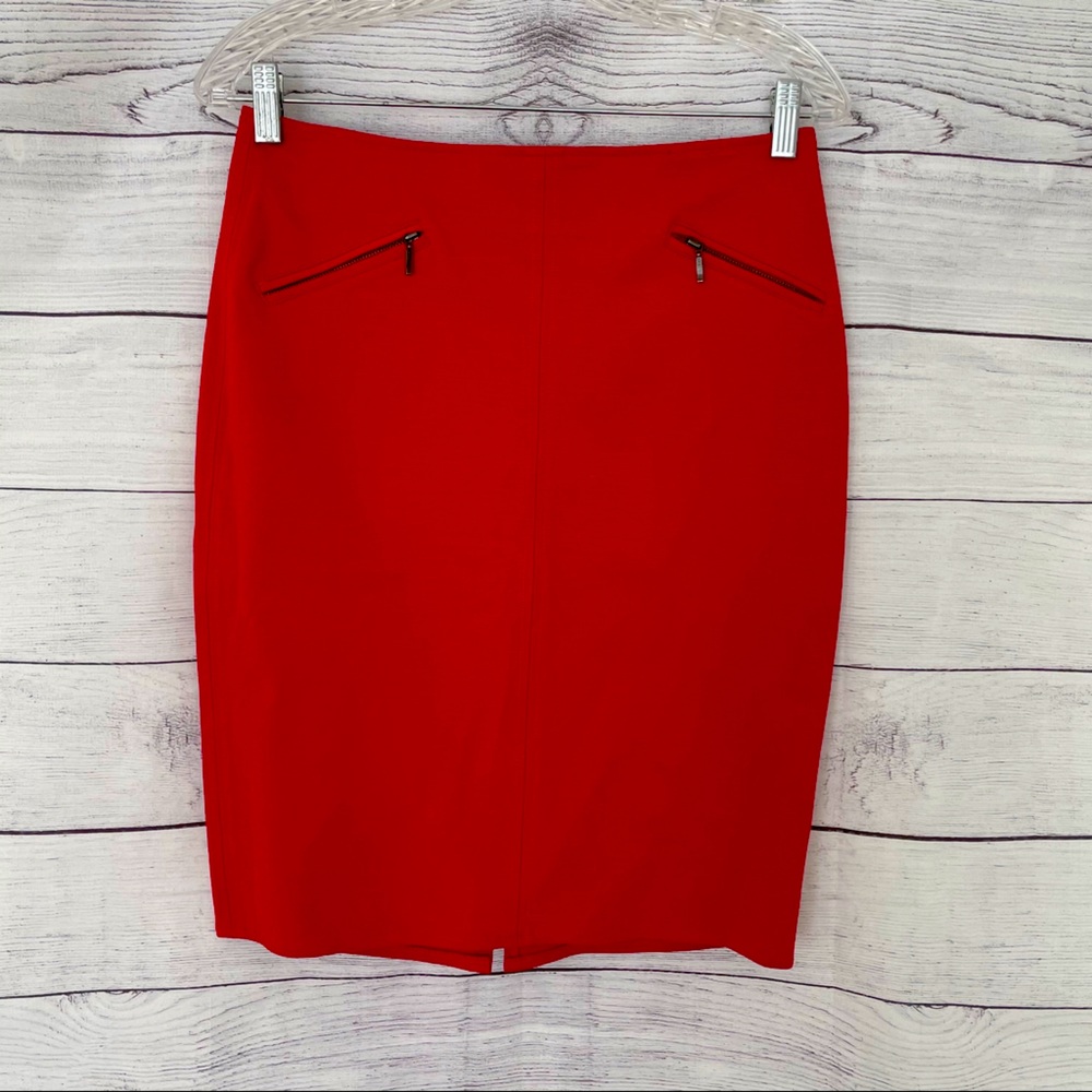 Red fitted skirt with decorative zippers